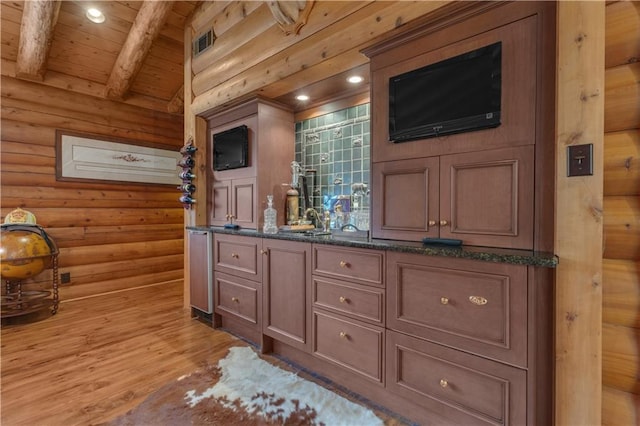 14501 Woolsey Rd, Hampton, GA 30228 - bathroom with double vanity, wood finished floors, a wood ceiling with exposed beams, rustic walls, and recessed lighting