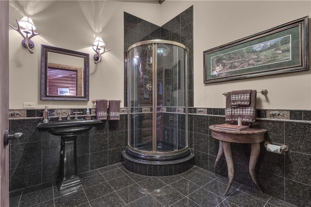 14501 Woolsey Rd, Hampton, GA 30228 - bathroom with tile walls, a shower stall, and a wainscoted wall