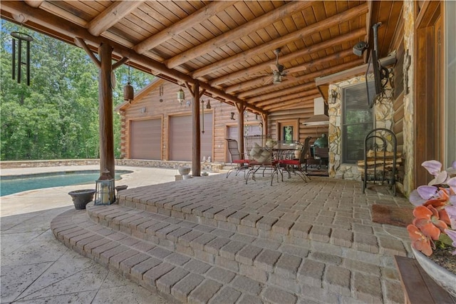 14501 Woolsey Rd, Hampton, GA 30228 - view of patio / terrace with an outdoor structure, an outdoor pool, a ceiling fan, outdoor dining space, and an attached garage