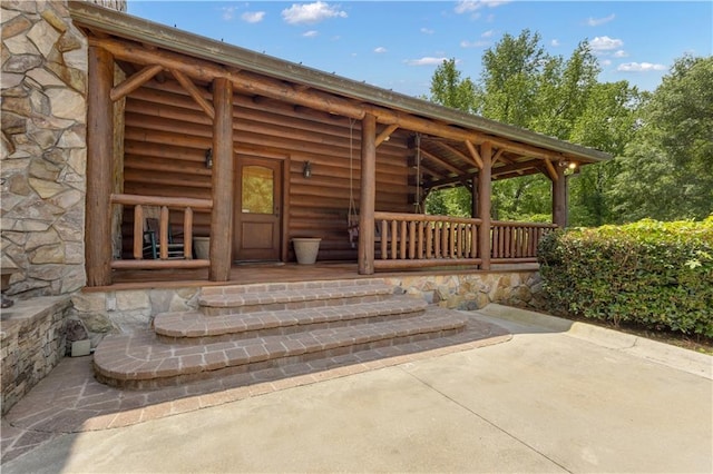 14501 Woolsey Rd, Hampton, GA 30228 - property entrance featuring stone siding and covered porch