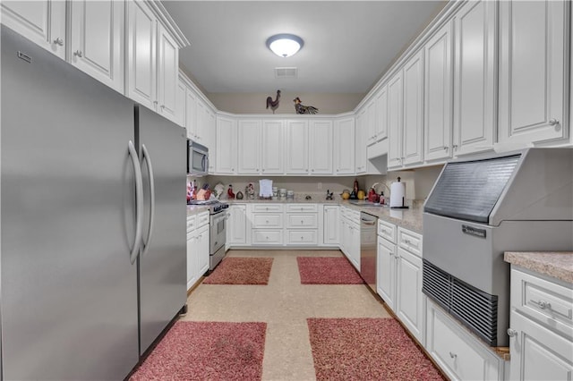 14501 Woolsey Rd, Hampton, GA 30228 - kitchen featuring stainless steel appliances, white cabinets, and light flooring