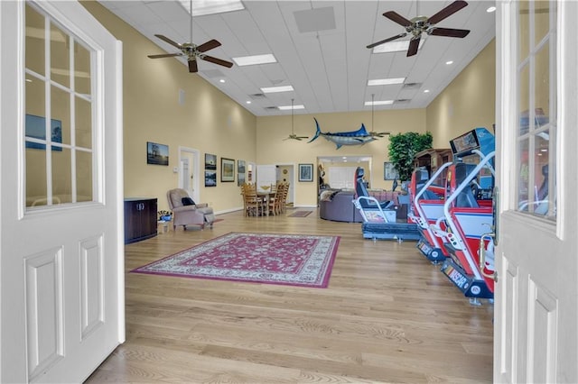 14501 Woolsey Rd, Hampton, GA 30228 - exercise area featuring a ceiling fan, wood finished floors, and a towering ceiling