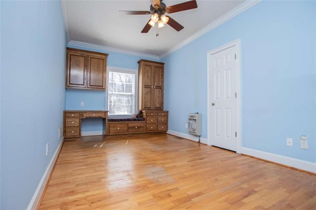 unfurnished bedroom featuring heating unit, ornamental molding, light wood-style flooring, baseboards, and ceiling fan