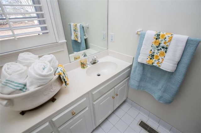 bathroom featuring tile patterned floors and vanity