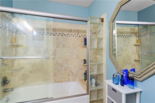 full bathroom featuring bath / shower combo with glass door