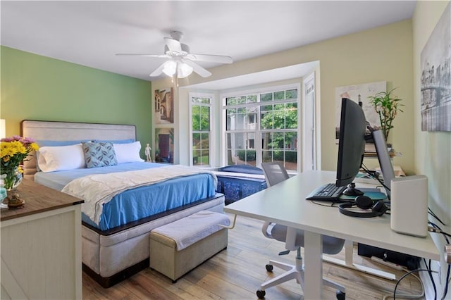 bedroom featuring a ceiling fan and wood finished floors