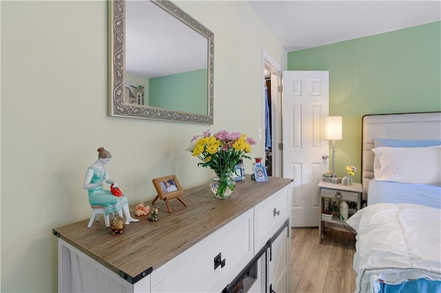 bedroom with light wood-style floors