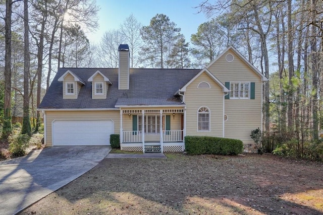 view of front of home featuring a garage and covered porch