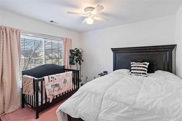 carpeted bedroom with ceiling fan