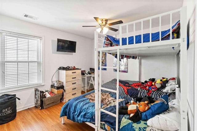 bedroom featuring ceiling fan and wood-type flooring