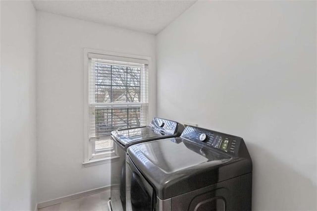 clothes washing area featuring washing machine and clothes dryer