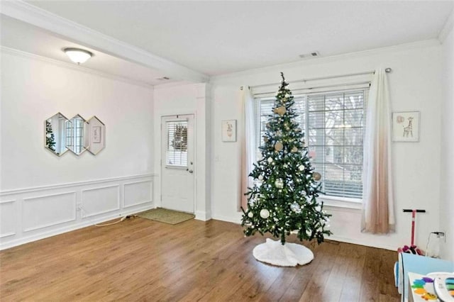 foyer entrance featuring hardwood / wood-style flooring and plenty of natural light