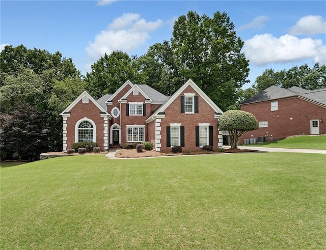 6630 Club Valley Ct, Suwanee, GA 30024 - view of front facade with a front yard and brick siding