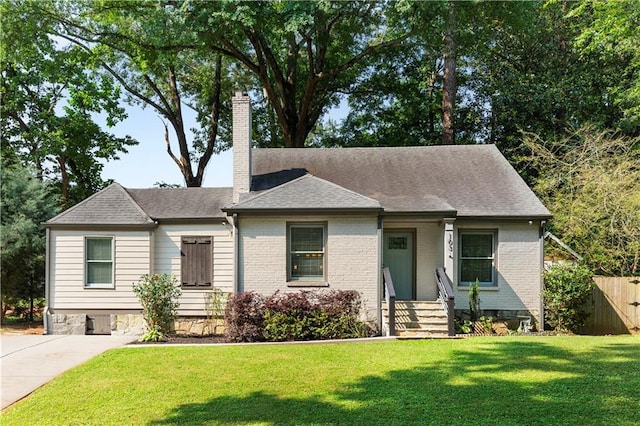 103 Willow Wood Cir SE, Atlanta, GA 30317 - view of front of home with a chimney, brick siding, and roof with shingles