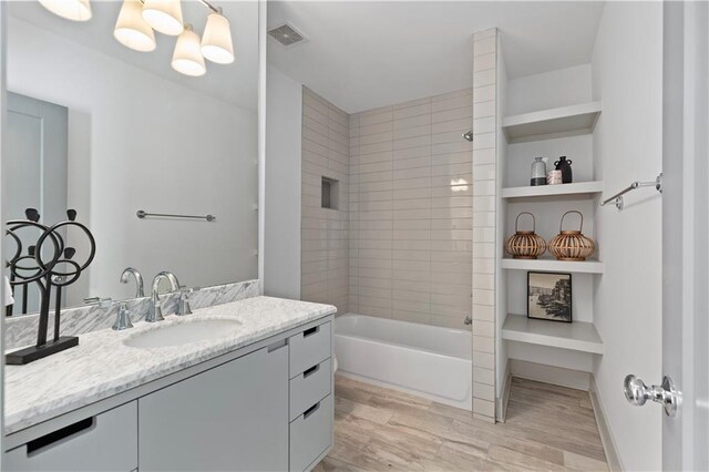 103 Willow Wood Cir SE, Atlanta, GA 30317 - full bathroom featuring wood finished floors, vanity, and  shower combination