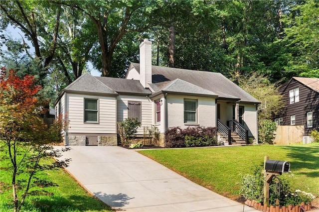 103 Willow Wood Cir SE, Atlanta, GA 30317 - bungalow-style house with driveway, a chimney, and brick siding