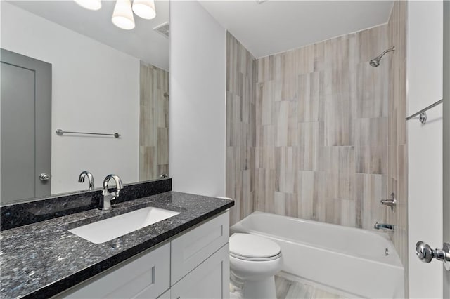 103 Willow Wood Cir SE, Atlanta, GA 30317 - bathroom featuring vanity, toilet, and bathtub / shower combination