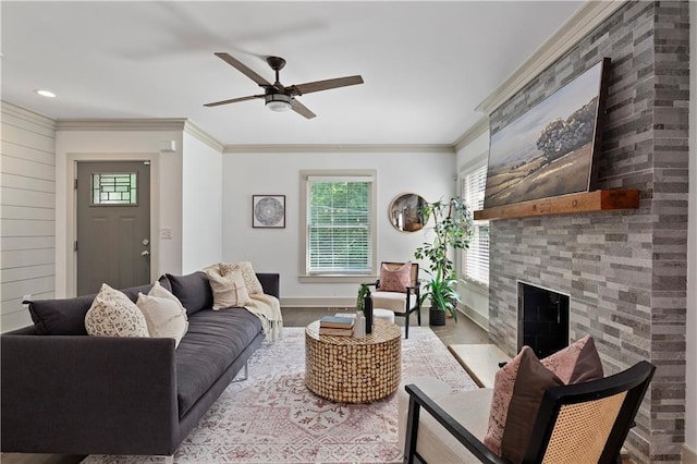 103 Willow Wood Cir SE, Atlanta, GA 30317 - living room featuring plenty of natural light, ornamental molding, ceiling fan, a fireplace, and wood finished floors