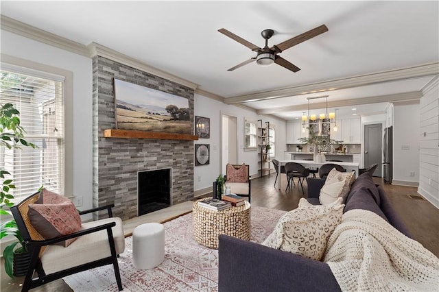 103 Willow Wood Cir SE, Atlanta, GA 30317 - living area featuring crown molding, dark wood-style flooring, ceiling fan, a fireplace, and baseboards