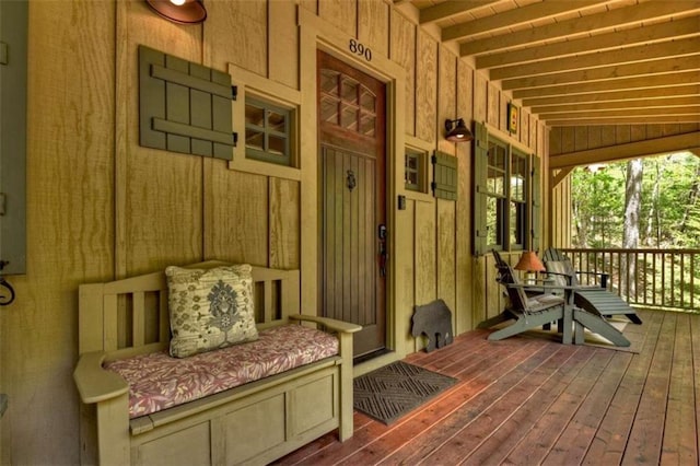 exterior space with vaulted ceiling with beams, dark hardwood / wood-style flooring, and wood walls