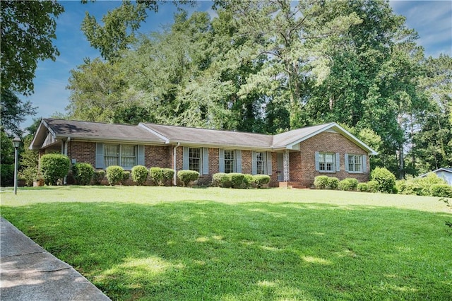 4581 Newcastle Cir, Lithonia, GA 30038 - single story home featuring brick siding and a front yard