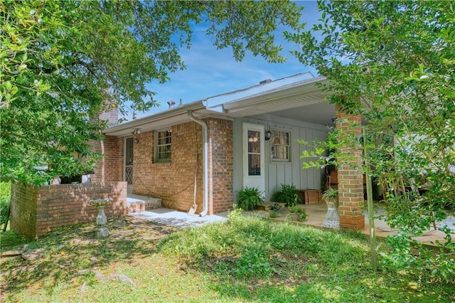 4581 Newcastle Cir, Lithonia, GA 30038 - view of side of home featuring brick siding and board and batten siding