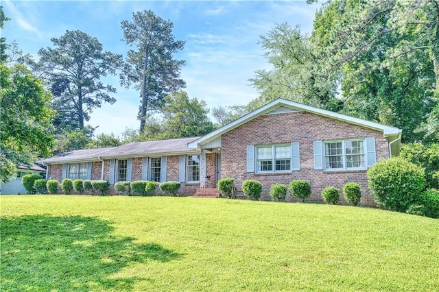 4581 Newcastle Cir, Lithonia, GA 30038 - ranch-style home with brick siding and a front lawn