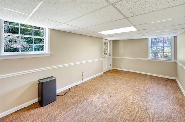 4581 Newcastle Cir, Lithonia, GA 30038 - below grade area featuring wood finished floors and a paneled ceiling