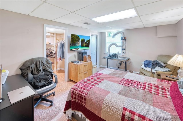 4581 Newcastle Cir, Lithonia, GA 30038 - bedroom with a drop ceiling, a spacious closet, wood finished floors, and a closet