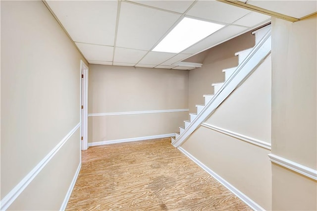 4581 Newcastle Cir, Lithonia, GA 30038 - finished below grade area featuring a drop ceiling, wood finished floors, and stairs