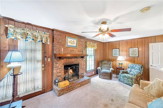 4581 Newcastle Cir, Lithonia, GA 30038 - carpeted living room featuring ceiling fan, a fireplace, and wood walls