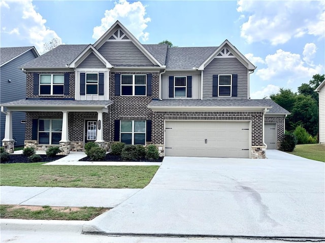 craftsman-style house with a front lawn and a garage