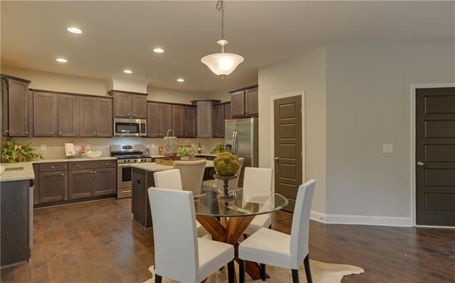 dining space with dark hardwood / wood-style floors