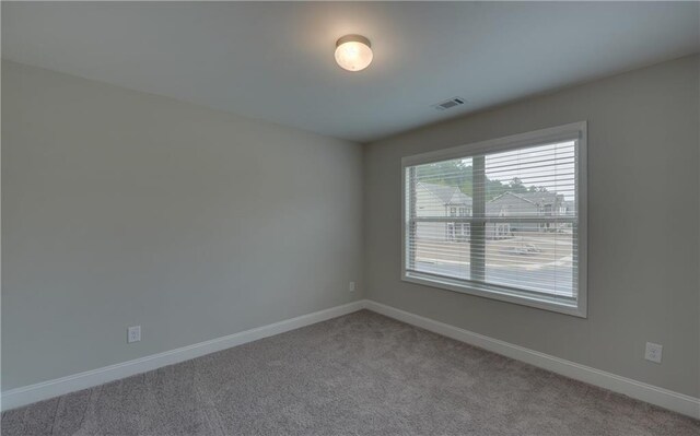 empty room with carpet flooring