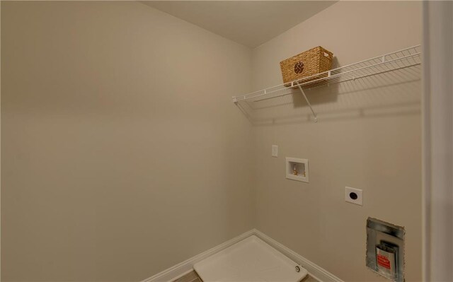 laundry area with hookup for an electric dryer and hookup for a washing machine