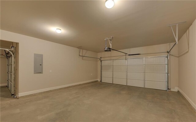 garage with electric panel and a garage door opener