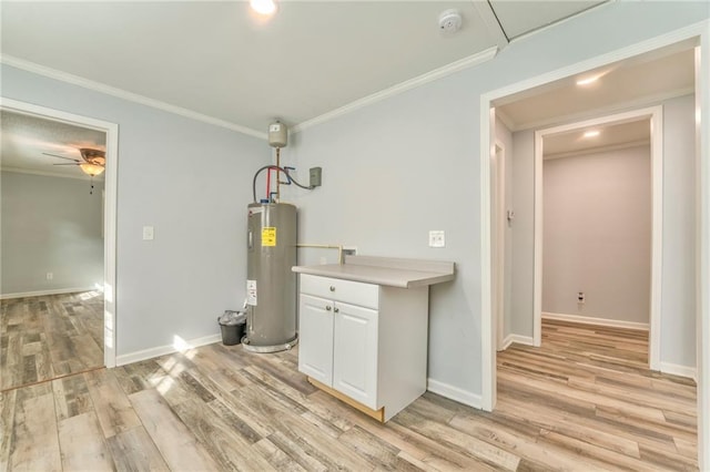 interior space featuring crown molding, ceiling fan, electric water heater, and light wood-type flooring