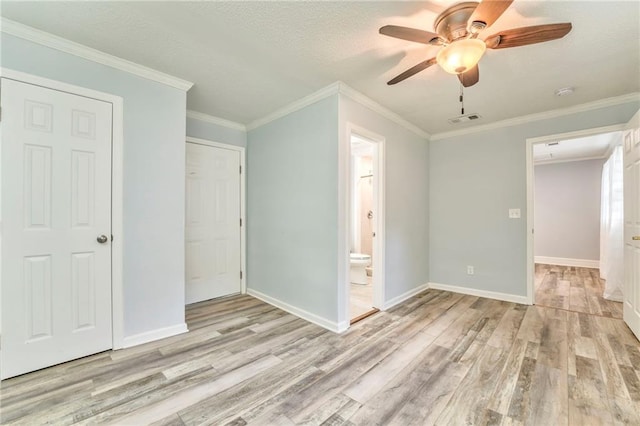 unfurnished bedroom featuring crown molding, ensuite bath, ceiling fan, a textured ceiling, and light wood-type flooring