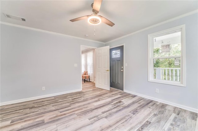 spare room with ornamental molding, ceiling fan, and light hardwood / wood-style flooring