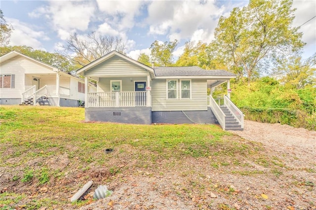 view of front of property with a porch and a front yard