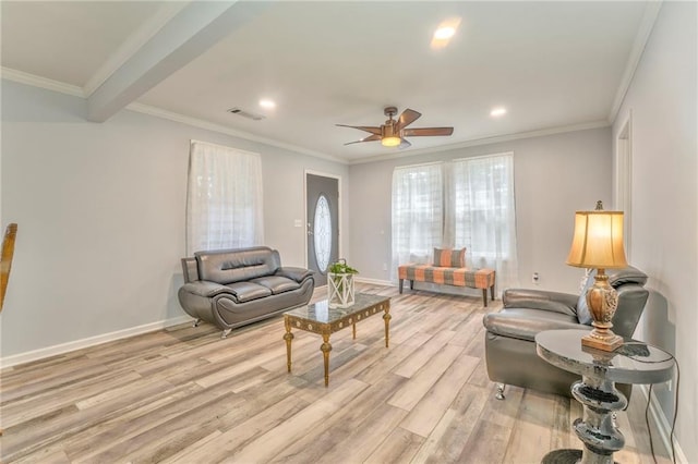 living room with crown molding, ceiling fan, and light hardwood / wood-style flooring