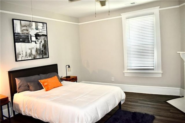 bedroom featuring dark hardwood / wood-style flooring