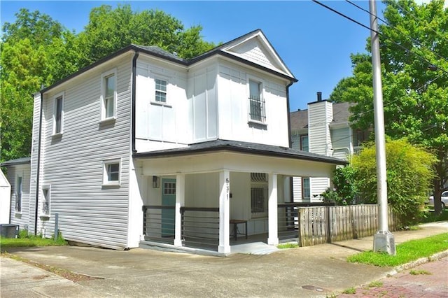 view of front of property featuring central AC unit and a porch