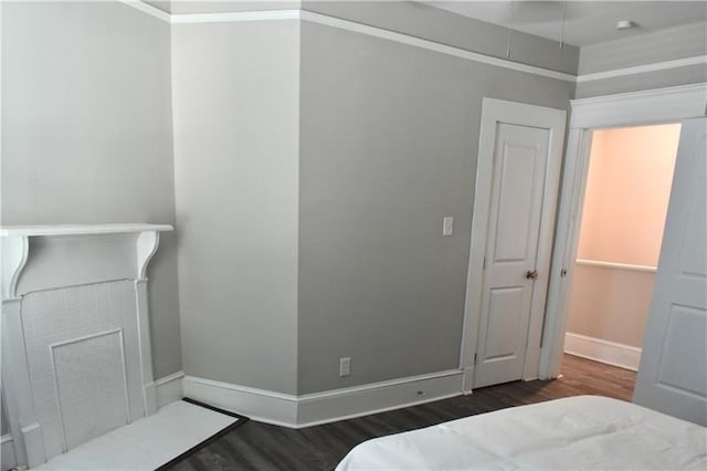 bedroom featuring dark hardwood / wood-style flooring