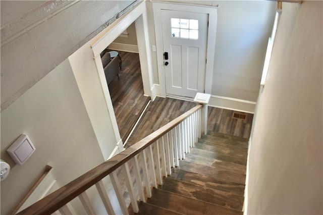 stairs with hardwood / wood-style flooring