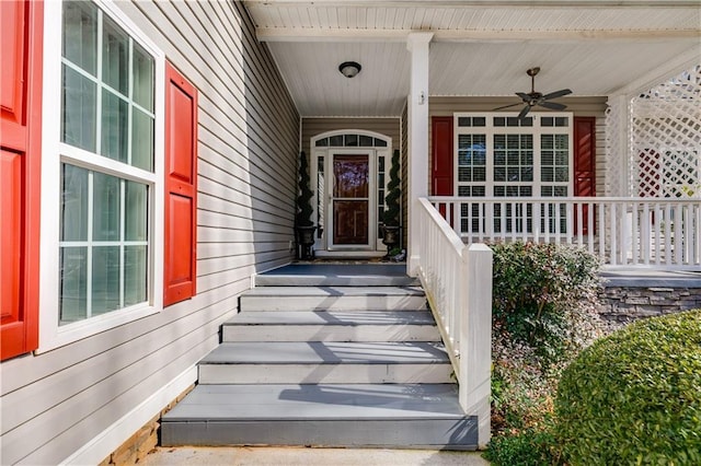 property entrance with a ceiling fan and covered porch