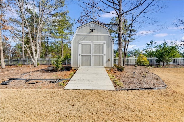 view of shed with a fenced backyard