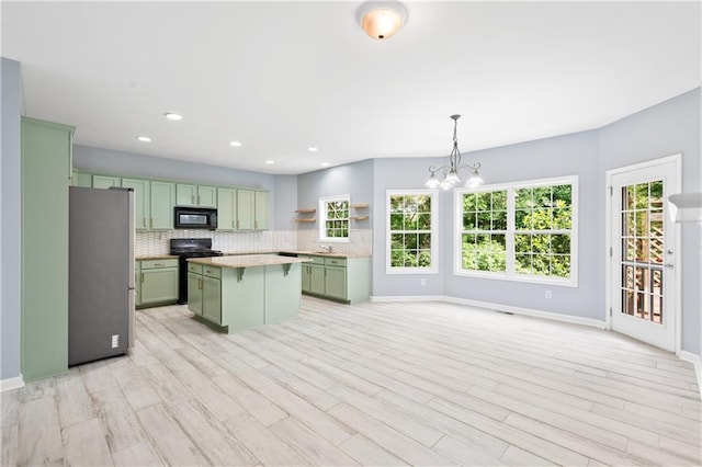 2595 Glaramara Ter, Cumming, GA 30041 - kitchen featuring green cabinets, black appliances, decorative backsplash, a chandelier, and open shelves