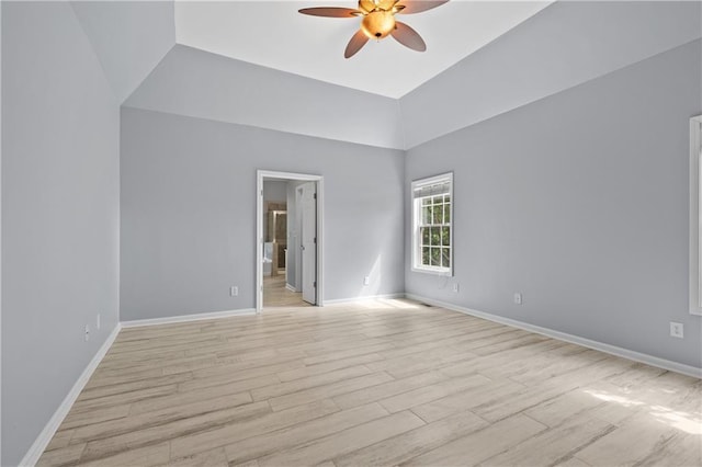 2595 Glaramara Ter, Cumming, GA 30041 - spare room featuring ceiling fan, light wood-type flooring, baseboards, and a towering ceiling