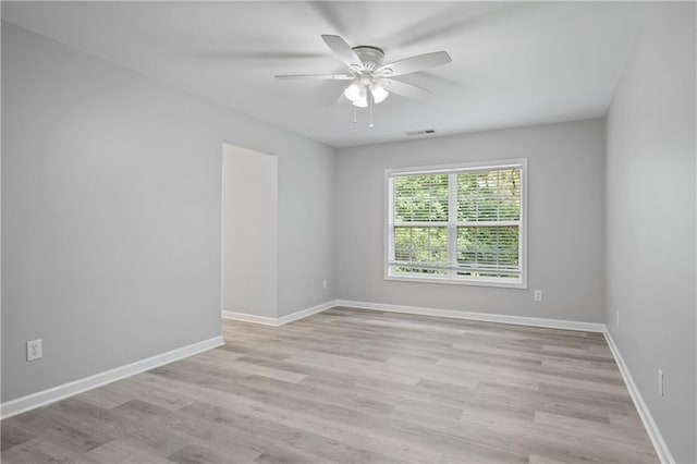2595 Glaramara Ter, Cumming, GA 30041 - spare room featuring ceiling fan, light wood-type flooring, and baseboards